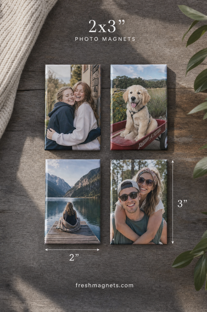 2x3 photo magnets: six rectangle magnets with couple, family and dog photos on a walnut table, size marked 2 by 3 inches, freshmagnets.com