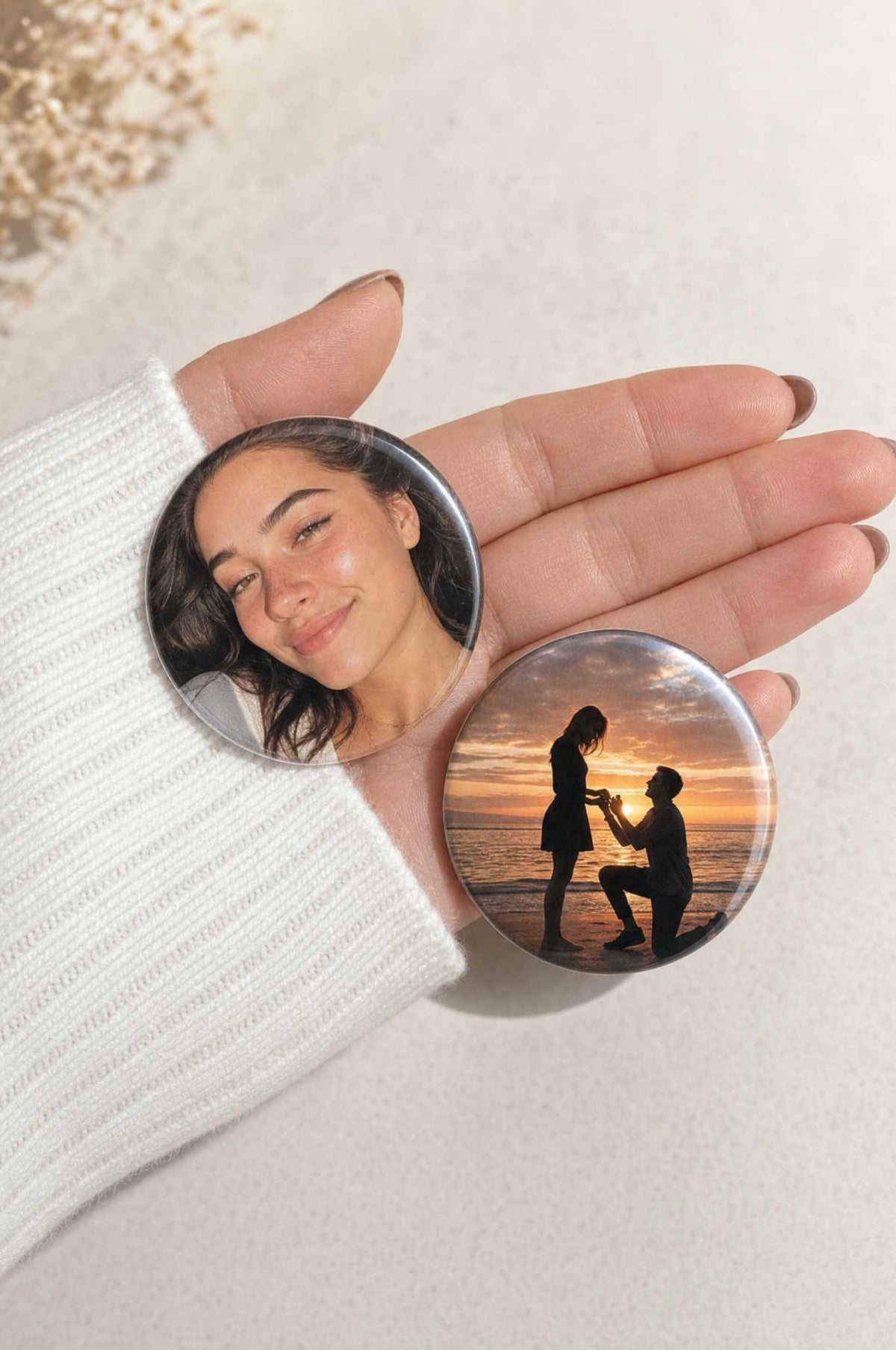 Two 2.25 inch round photo magnets held in a hand, a portrait and a proposal photo