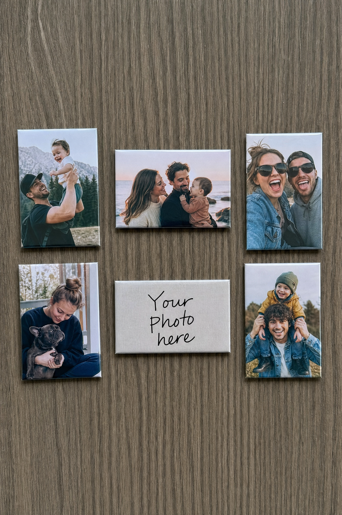 2x3 photo magnets on a grey fridge door, five couple photos and one blank magnet reading Your photo here